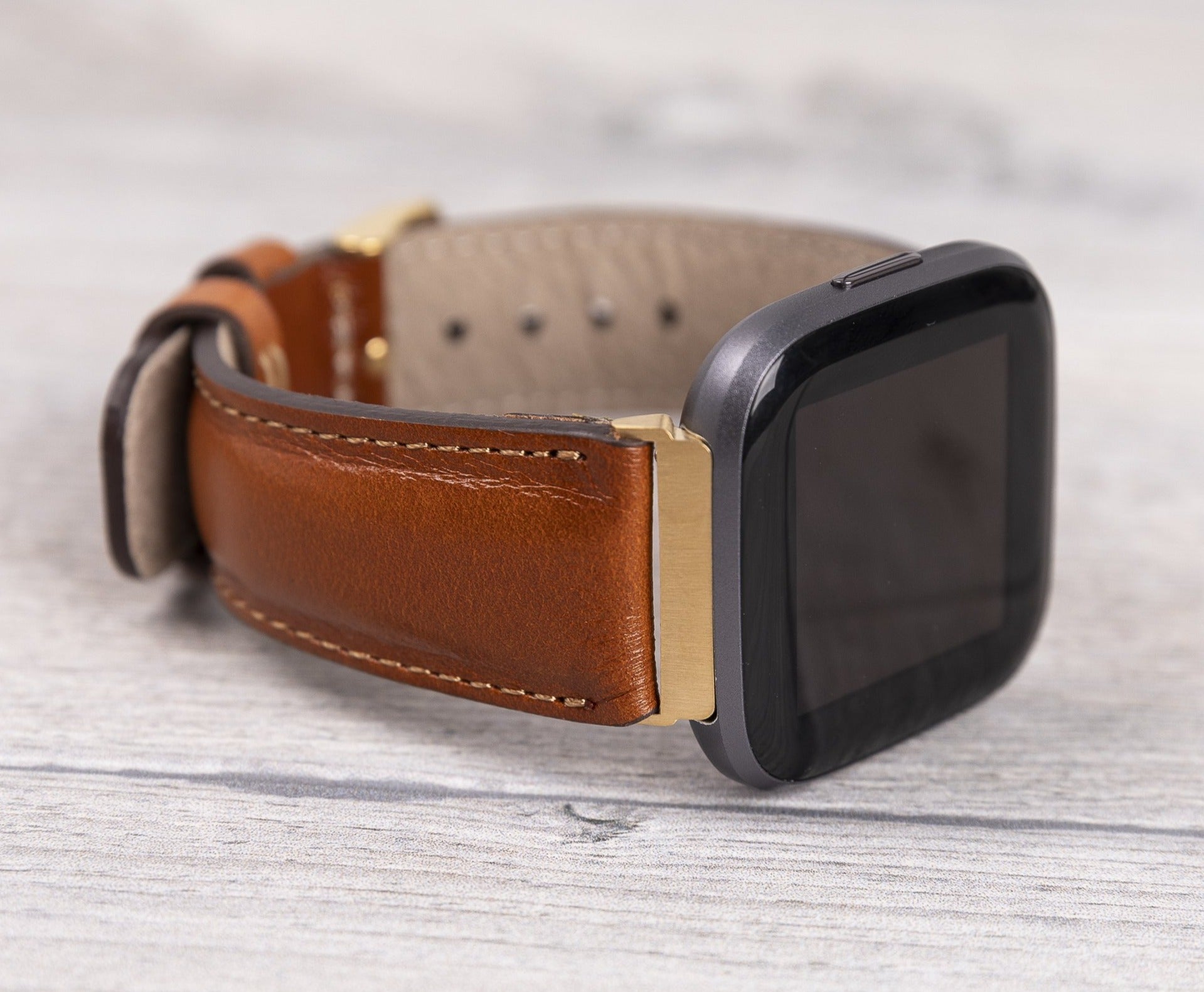 Klassisches Fitbit-Uhrenarmband aus hellbraunem Leder 